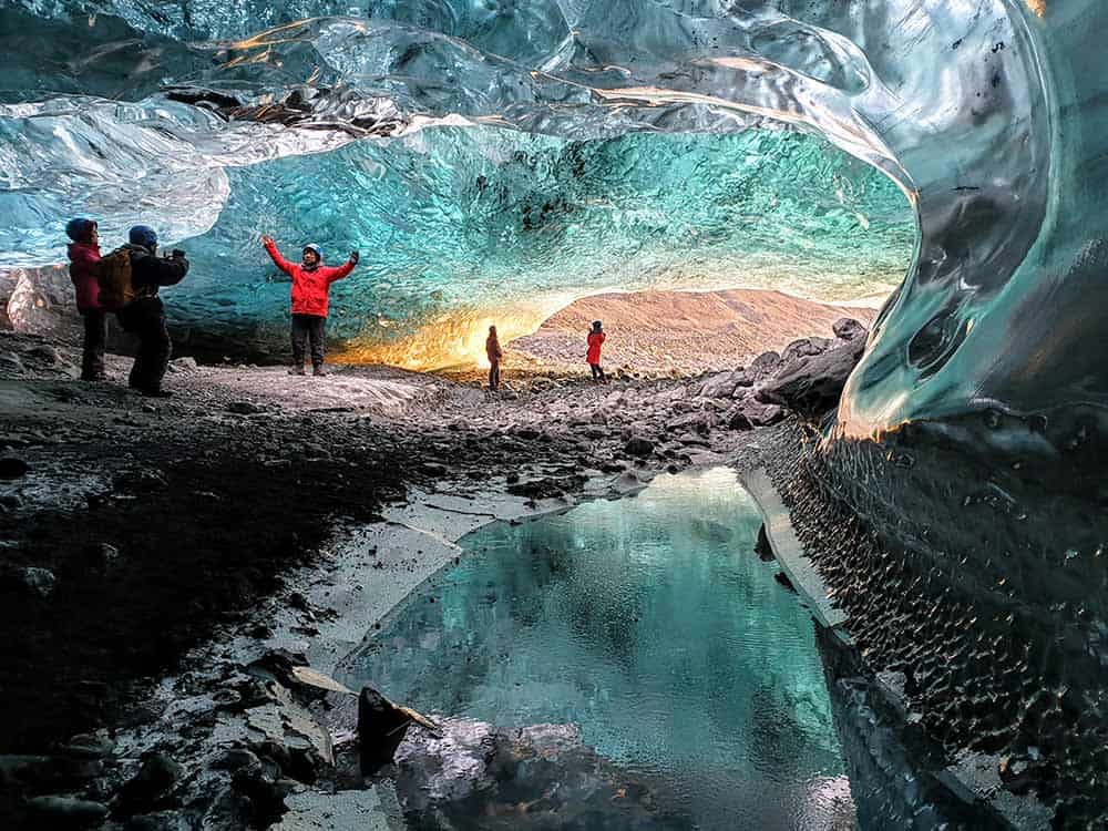 Guide leading guests inside the ice cave