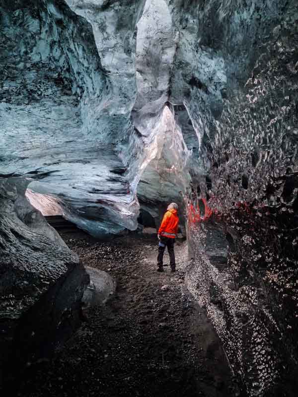Explorer in stunning ice cave
