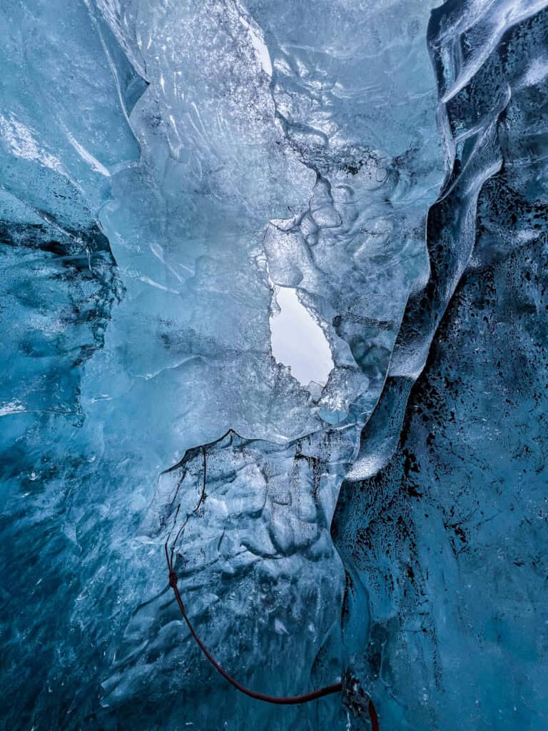 Glacial ice with a reflective opening., New Glacier Tour,