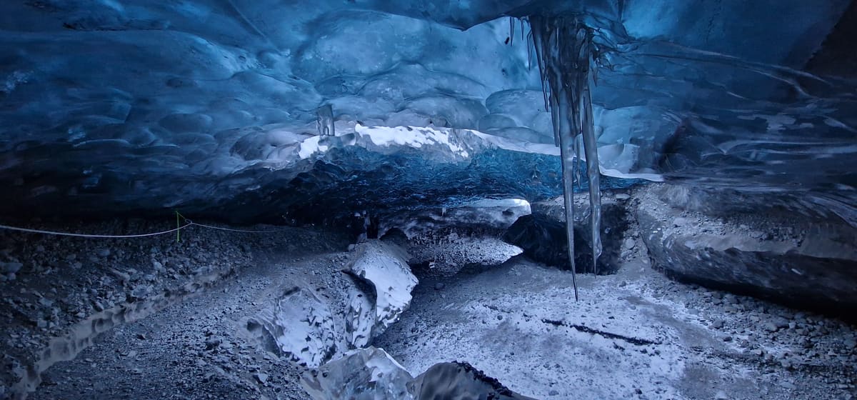 A roped walking line inside a Vatnajökull ice cave marking the safe route for guests